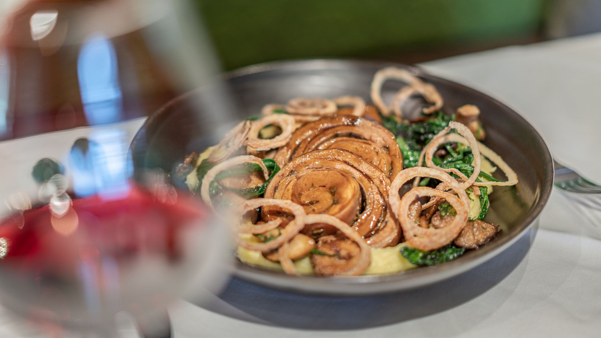 The heights of indulgence in Vent: our restaurant, Die Post Cooked dish with rolled meat and fried onions in a bowl
