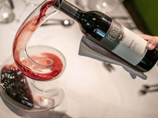 The heights of indulgence in Vent: our restaurant, Die Post Red wine being poured into a decanter