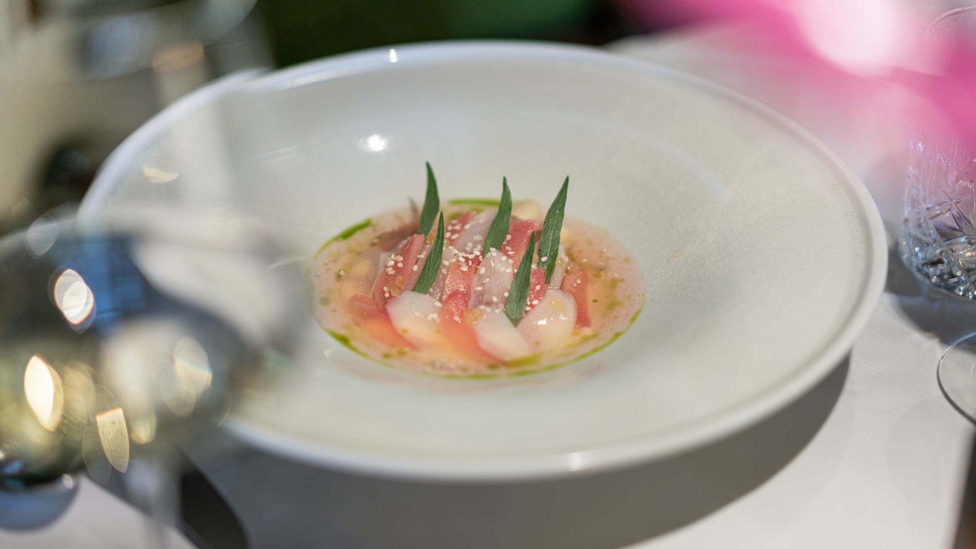 The heights of indulgence in Vent: our restaurant, Die Post Delicately plated fish with sauce and leaves in a white deep plate